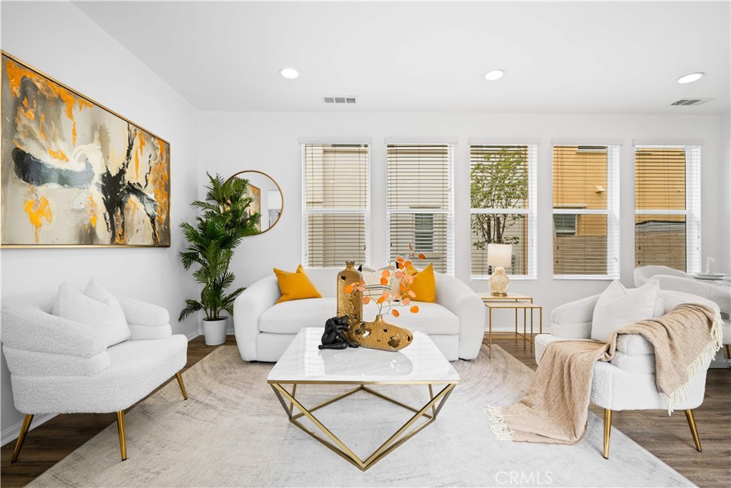 145 Mongoose Irvine, CA 92618 - Photo 5 of 37 a living room with furniture and a large window