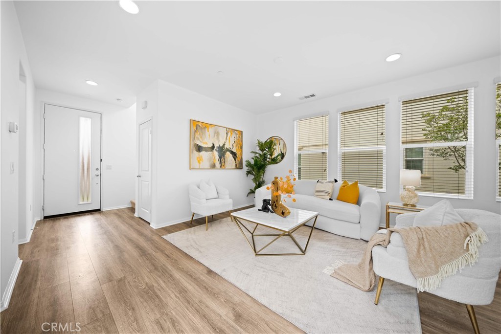 145 Mongoose Irvine, CA 92618 - Photo 6 of 37 a living room with furniture and a window