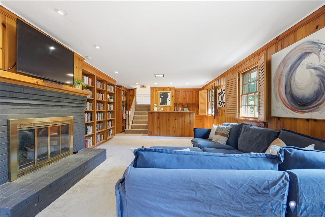 6405 Buckhill Road Richmond, VA 23225 - Photo 32 of 71 Spacious living area featuring extensive wood pane