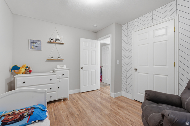282 West 960 South, Unit C Provo, UT 84601 - Photo 25 of 33 Bedroom with light wood-style flooring and baseboards