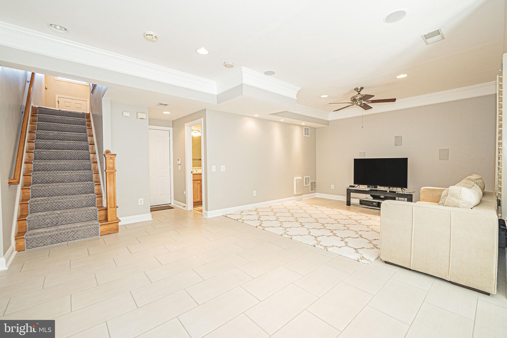 5448 Edsall Ridge Place Alexandria, VA 22312 - Photo 35 of 52 a living room with furniture and a flat screen tv