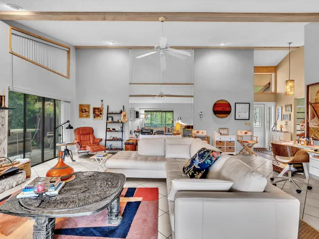 a kitchen with stainless steel appliances granite countertop a sink cabinets and wooden floor