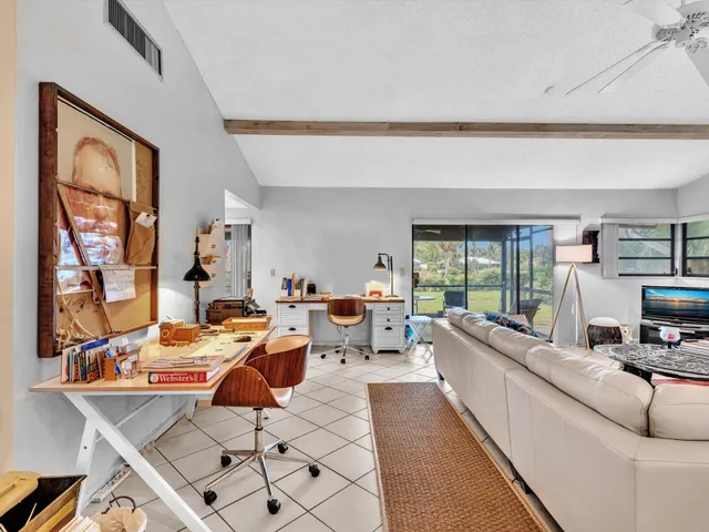 a kitchen with stainless steel appliances granite countertop a stove a refrigerator and a cabinets