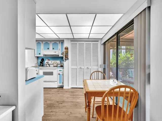 a kitchen with stainless steel appliances granite countertop a stove and refrigerator