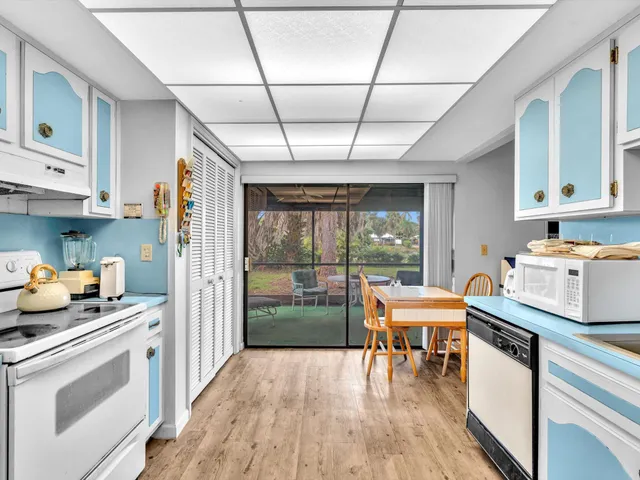 a spacious bedroom with a bed and a flat screen tv