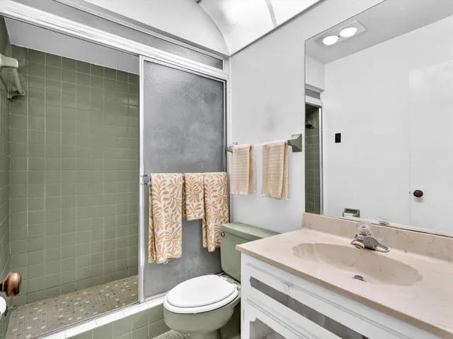 a bathroom with a sink a vanity and a mirror