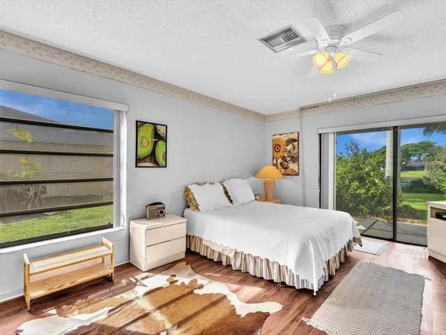 a bedroom with a bed and a television