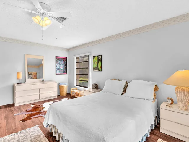 a view of a chairs and table in patio with a yard