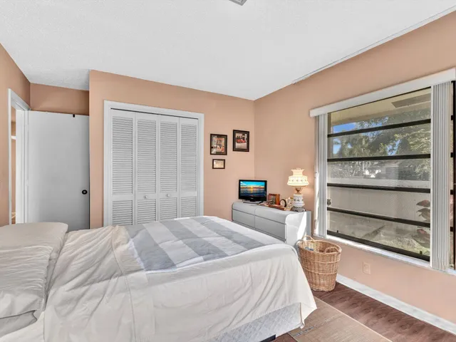 a view of a garden with a building in the background