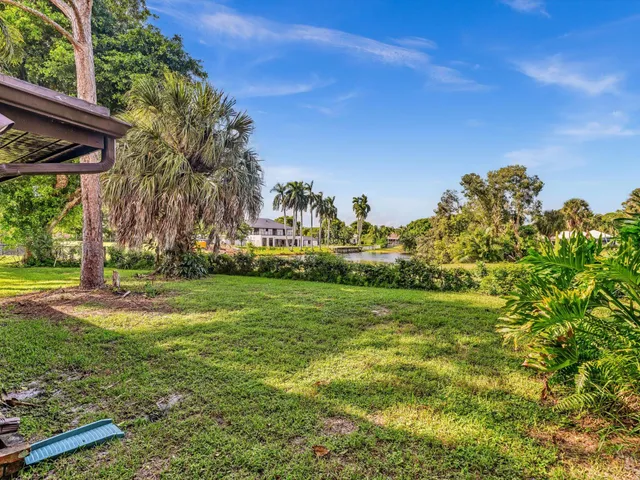 an aerial view of residential building with outdoor space and lake view