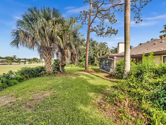 a view of a swimming pool with outdoor seating