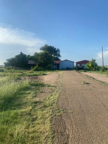 a view of a lake with houses in the back