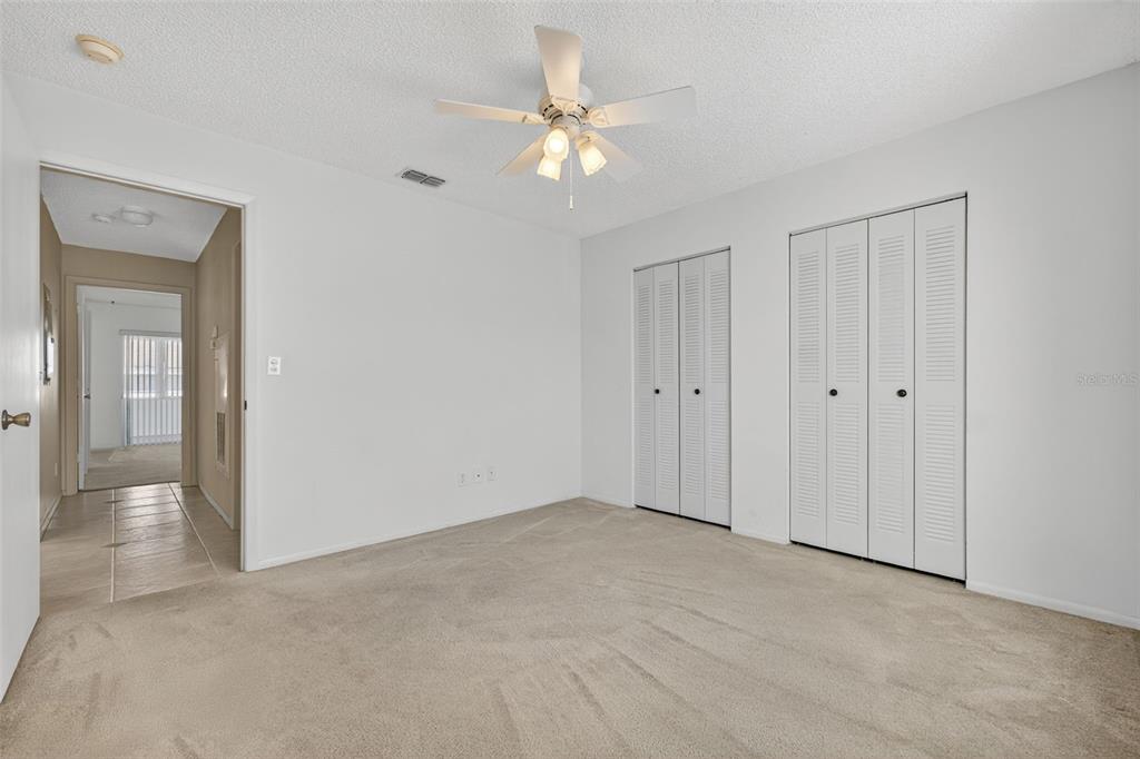 64 Winter Ridge Road, Unit 64 Winter Haven, FL 33881 - Photo 20 of 52 a view of an empty room with a fan