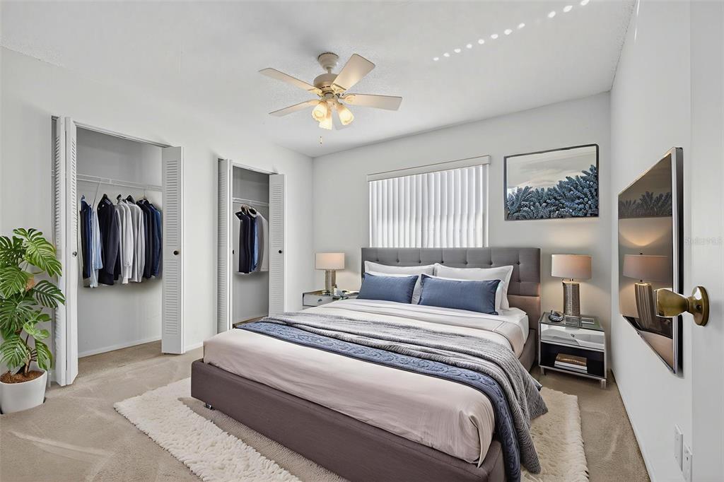 64 Winter Ridge Road, Unit 64 Winter Haven, FL 33881 - Photo 21 of 52 a bedroom with a bed and a chandelier