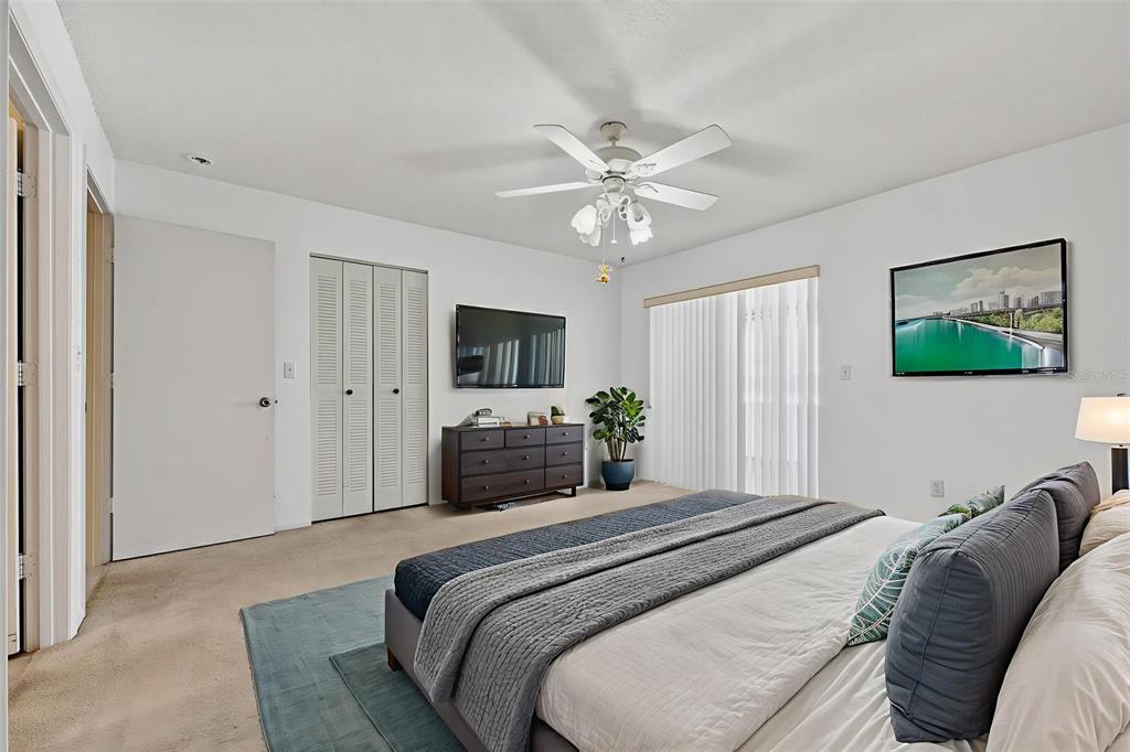 64 Winter Ridge Road, Unit 64 Winter Haven, FL 33881 - Photo 28 of 52 a bedroom with a bed and a flat screen tv