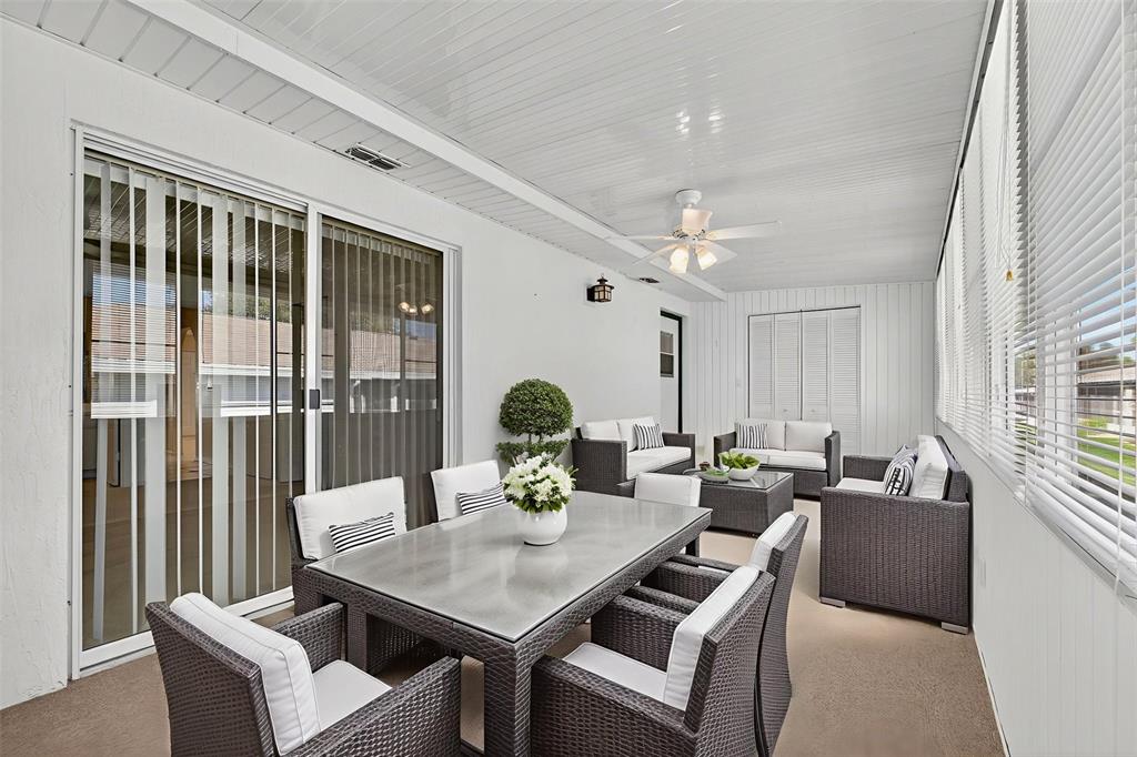 64 Winter Ridge Road, Unit 64 Winter Haven, FL 33881 - Photo 33 of 52 a living room with furniture and a large window