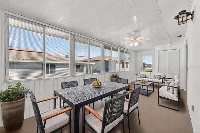 a outdoor dining space with furniture and outdoor view