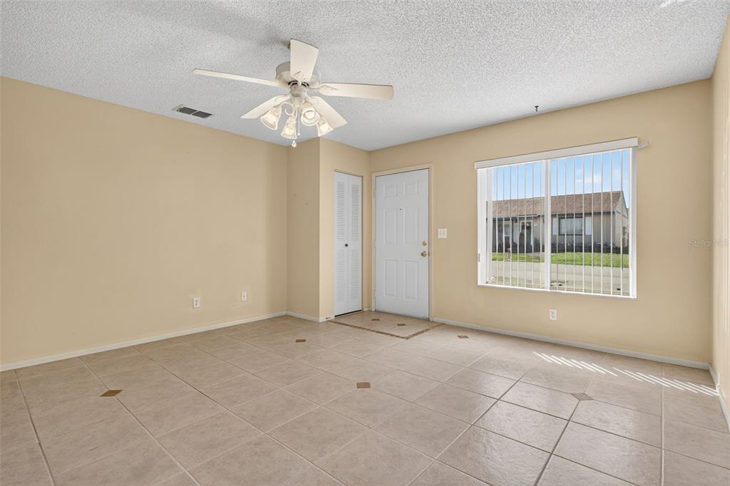 64 Winter Ridge Road, Unit 64 Winter Haven, FL 33881 - Photo 5 of 52 a view of an empty room with a window
