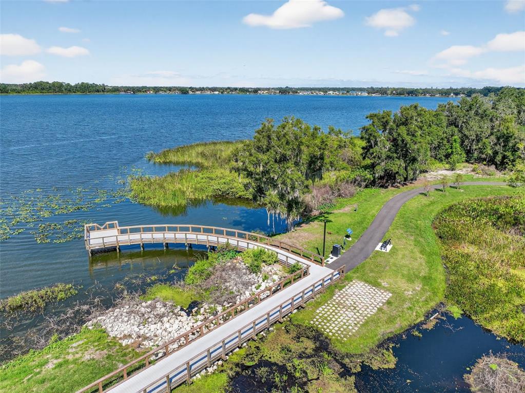 64 Winter Ridge Road, Unit 64 Winter Haven, FL 33881 - Photo 51 of 52 view of a lake with a house in the background