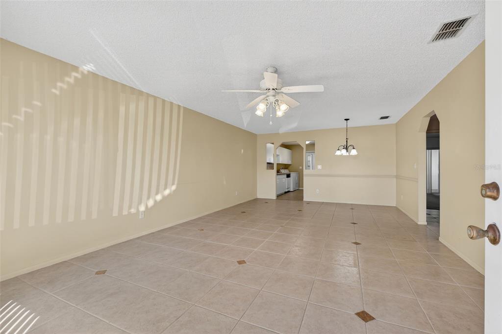 64 Winter Ridge Road, Unit 64 Winter Haven, FL 33881 - Photo 7 of 52 a view of empty room with a ceiling fan