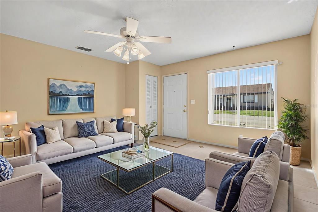64 Winter Ridge Road, Unit 64 Winter Haven, FL 33881 - Photo 9 of 52 a living room with furniture and a large window