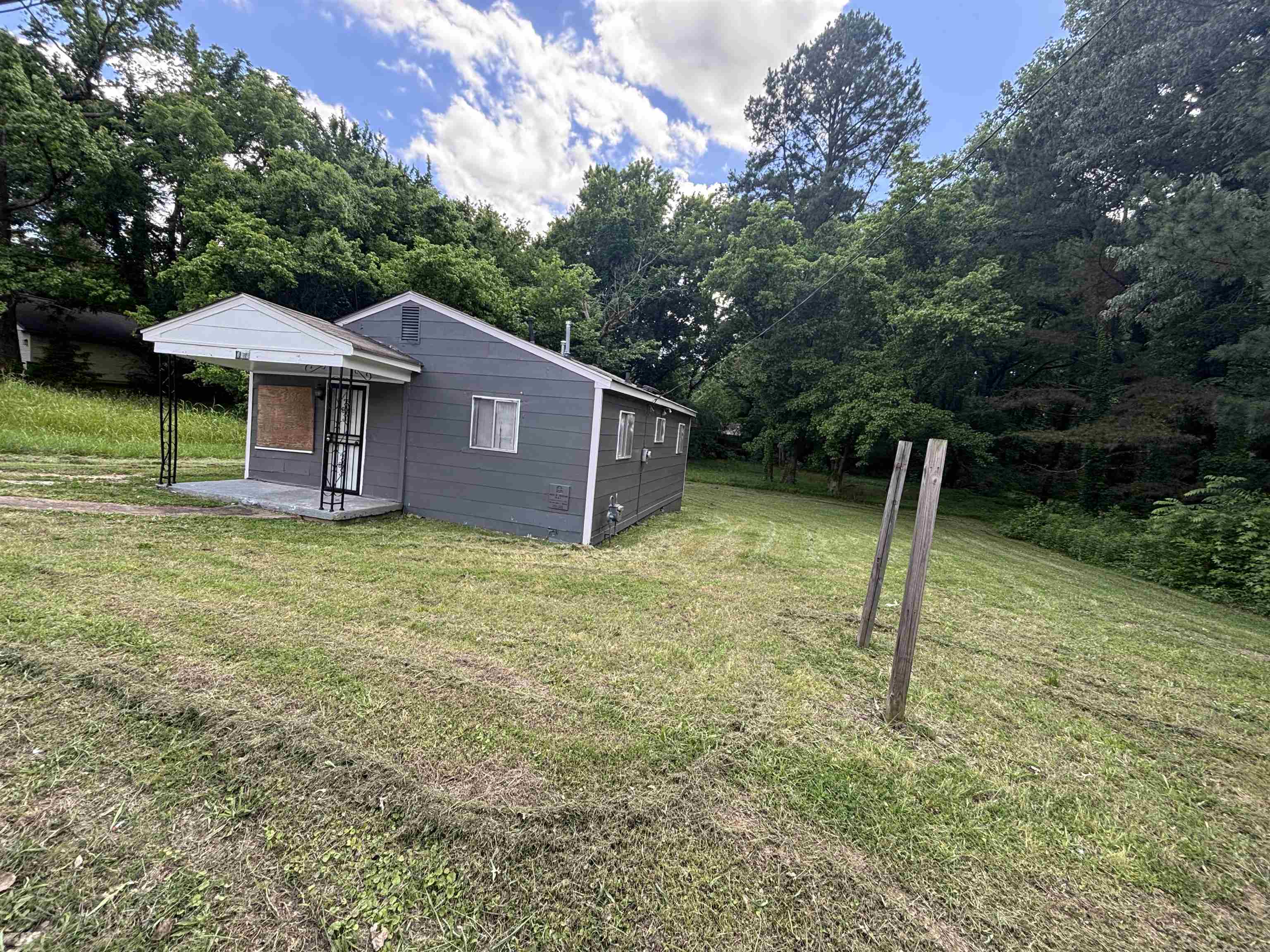 3589 Hawkins Mill Road Memphis, TN 38128 - Photo 2 of 9 a view of a house with a backyard