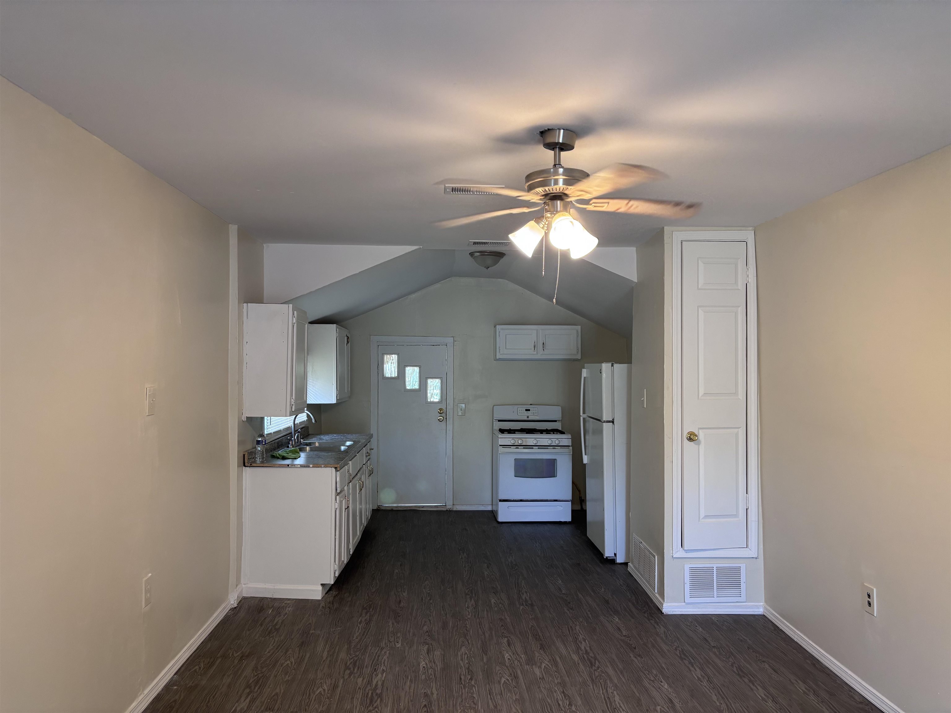 3589 Hawkins Mill Road Memphis, TN 38128 - Photo 5 of 9 wooden floor in an empty room with a chandelier