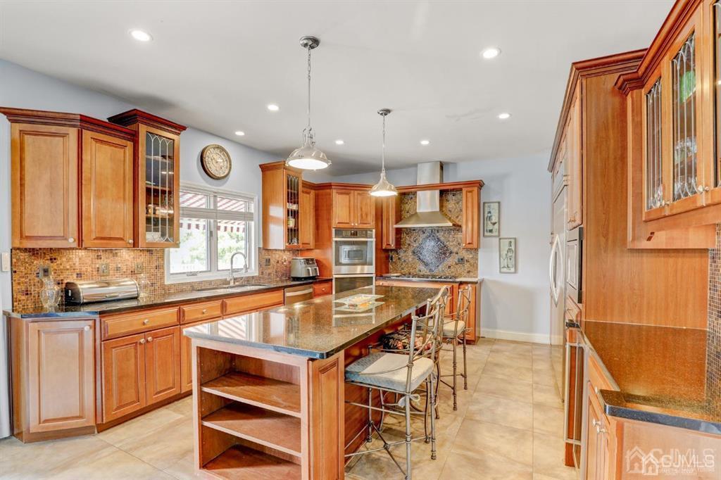 2 The Summit Holmdel, NJ 07733 - Photo 12 of 57 a large kitchen with a large window and stainless steel appliances