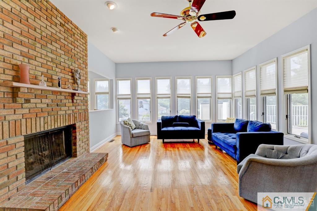 2 The Summit Holmdel, NJ 07733 - Photo 22 of 57 a living room with furniture and a fireplace