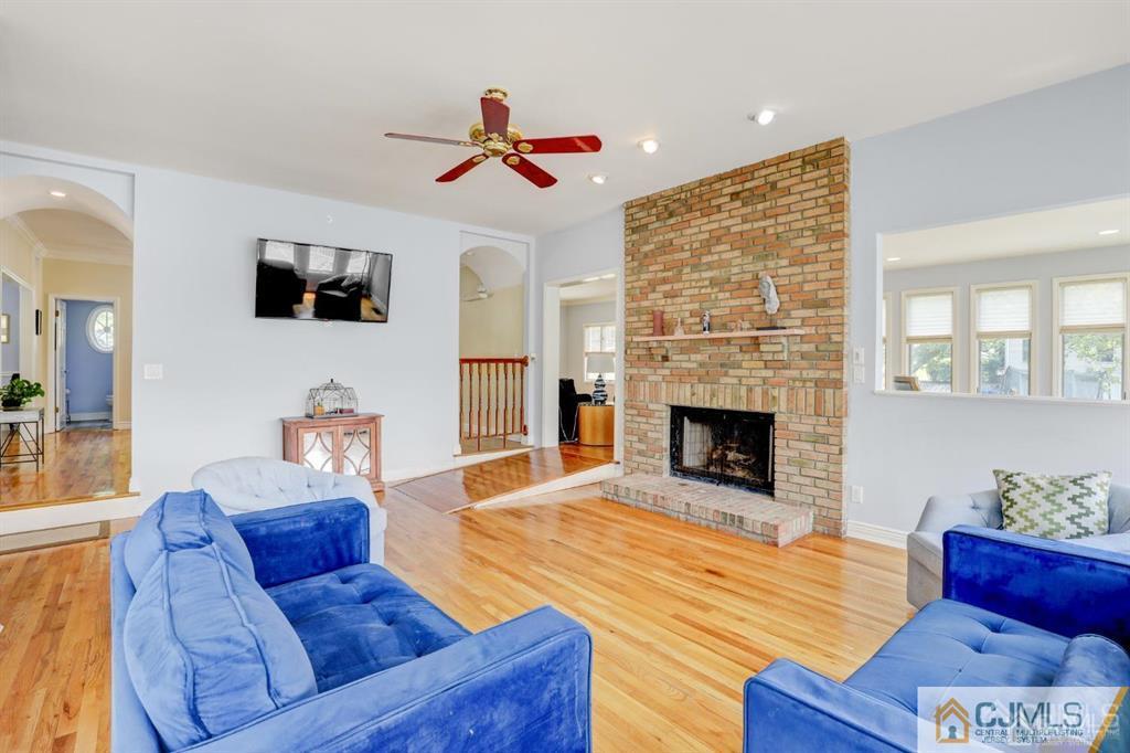 2 The Summit Holmdel, NJ 07733 - Photo 24 of 57 a living room with furniture and a fireplace