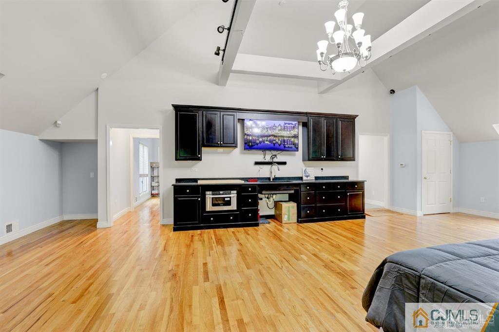 2 The Summit Holmdel, NJ 07733 - Photo 27 of 57 a living room with furniture and a flat screen tv