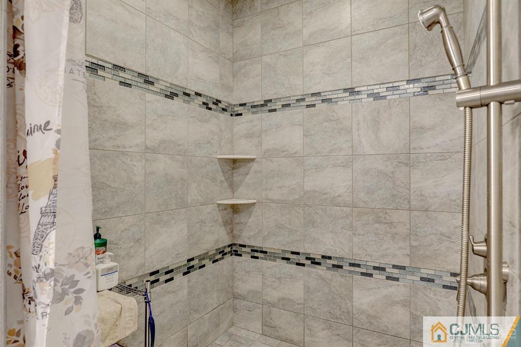 2 The Summit Holmdel, NJ 07733 - Photo 31 of 57 a bathroom with a shower