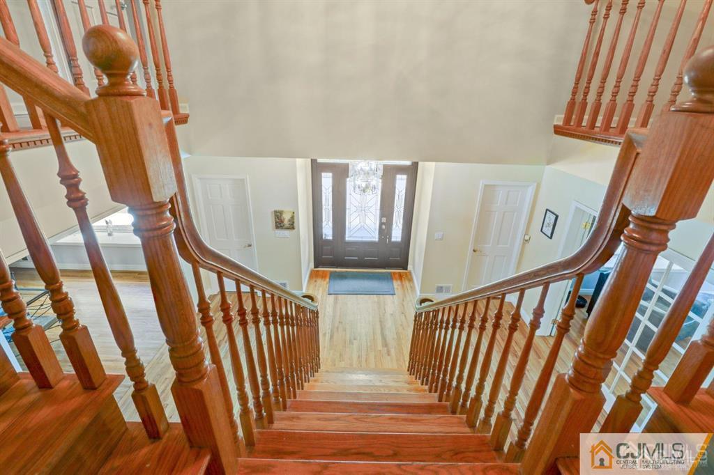 2 The Summit Holmdel, NJ 07733 - Photo 37 of 57 a view of staircase with railing and a rug