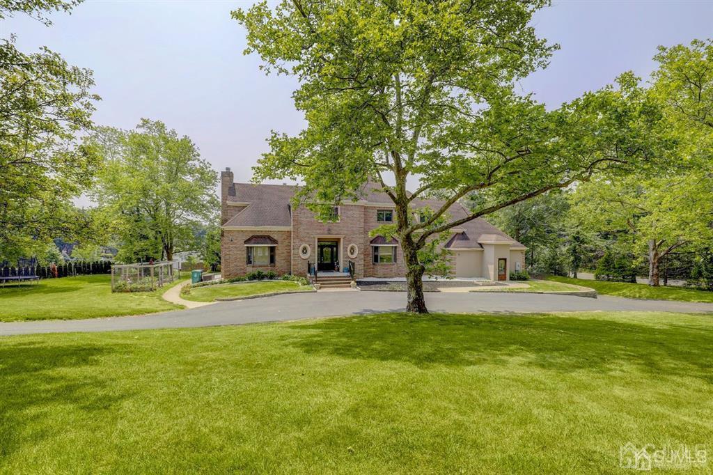 2 The Summit Holmdel, NJ 07733 - Photo 4 of 57 a house view with a sitting space and garden