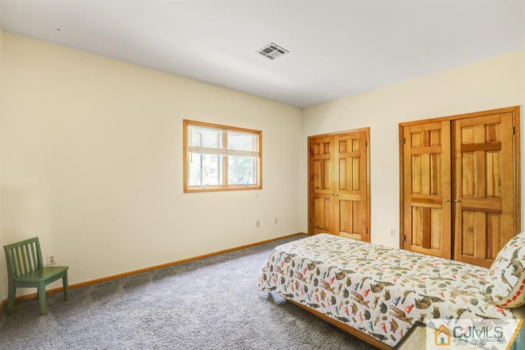 2 The Summit Holmdel, NJ 07733 - Photo 43 of 57 a bedroom with a bed and a window