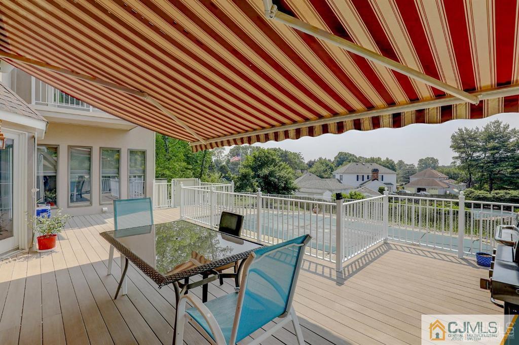 2 The Summit Holmdel, NJ 07733 - Photo 51 of 57 a patio with wooden floor and outdoor seating