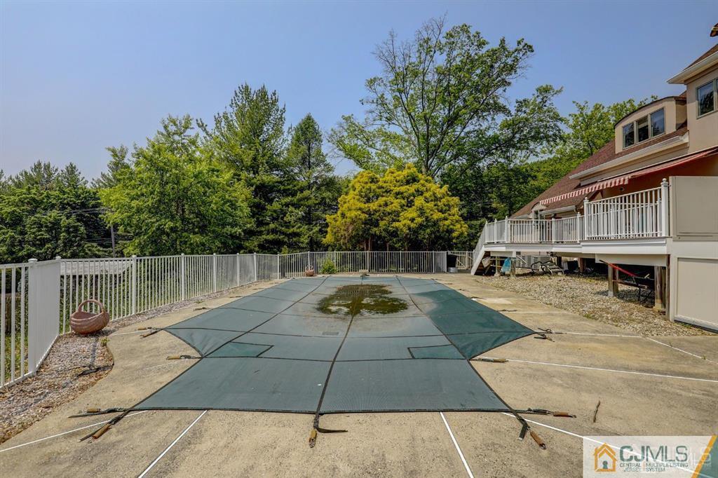 2 The Summit Holmdel, NJ 07733 - Photo 54 of 57 a view of backyard with swimming pool and seating space