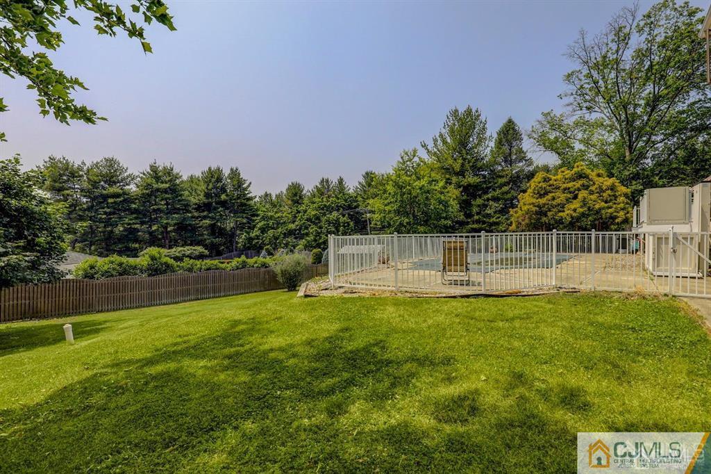 2 The Summit Holmdel, NJ 07733 - Photo 56 of 57 a view of a swimming pool with a garden
