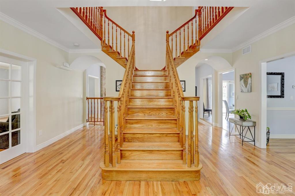 2 The Summit Holmdel, NJ 07733 - Photo 6 of 57 a view of entryway and hall with wooden floor