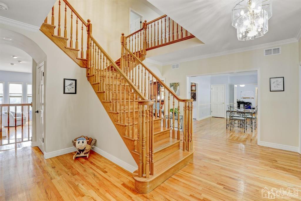 2 The Summit Holmdel, NJ 07733 - Photo 7 of 57 a view of entryway and hall with wooden floor