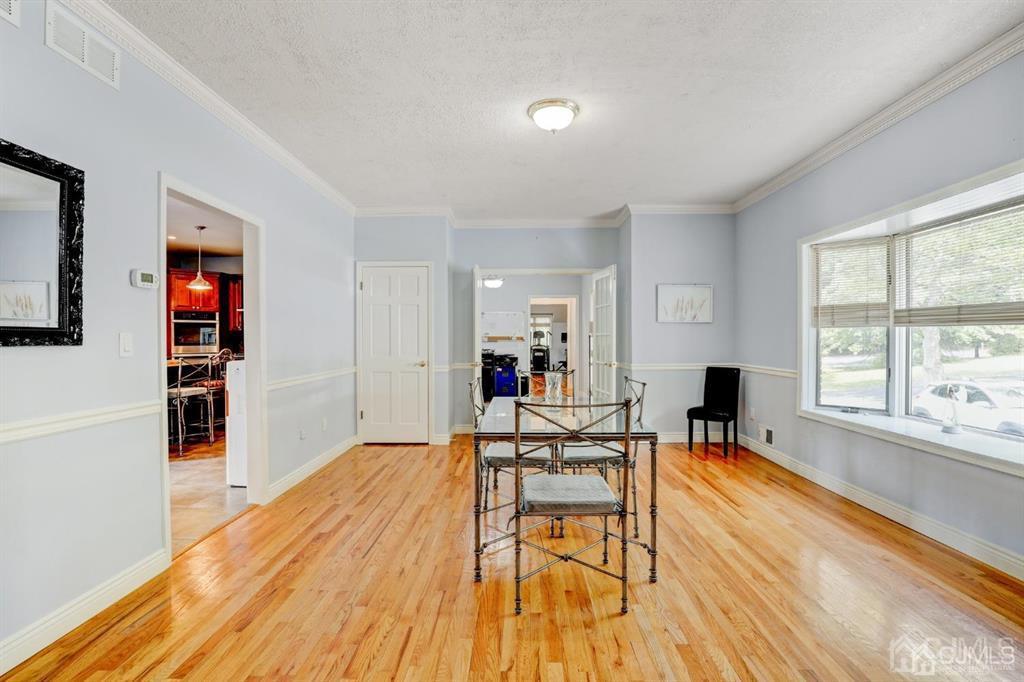 2 The Summit Holmdel, NJ 07733 - Photo 8 of 57 a living room with furniture and a wooden floor