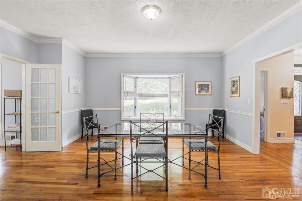 2 The Summit Holmdel, NJ 07733 - Photo 10 of 57 a view of a room with furniture and wooden floor