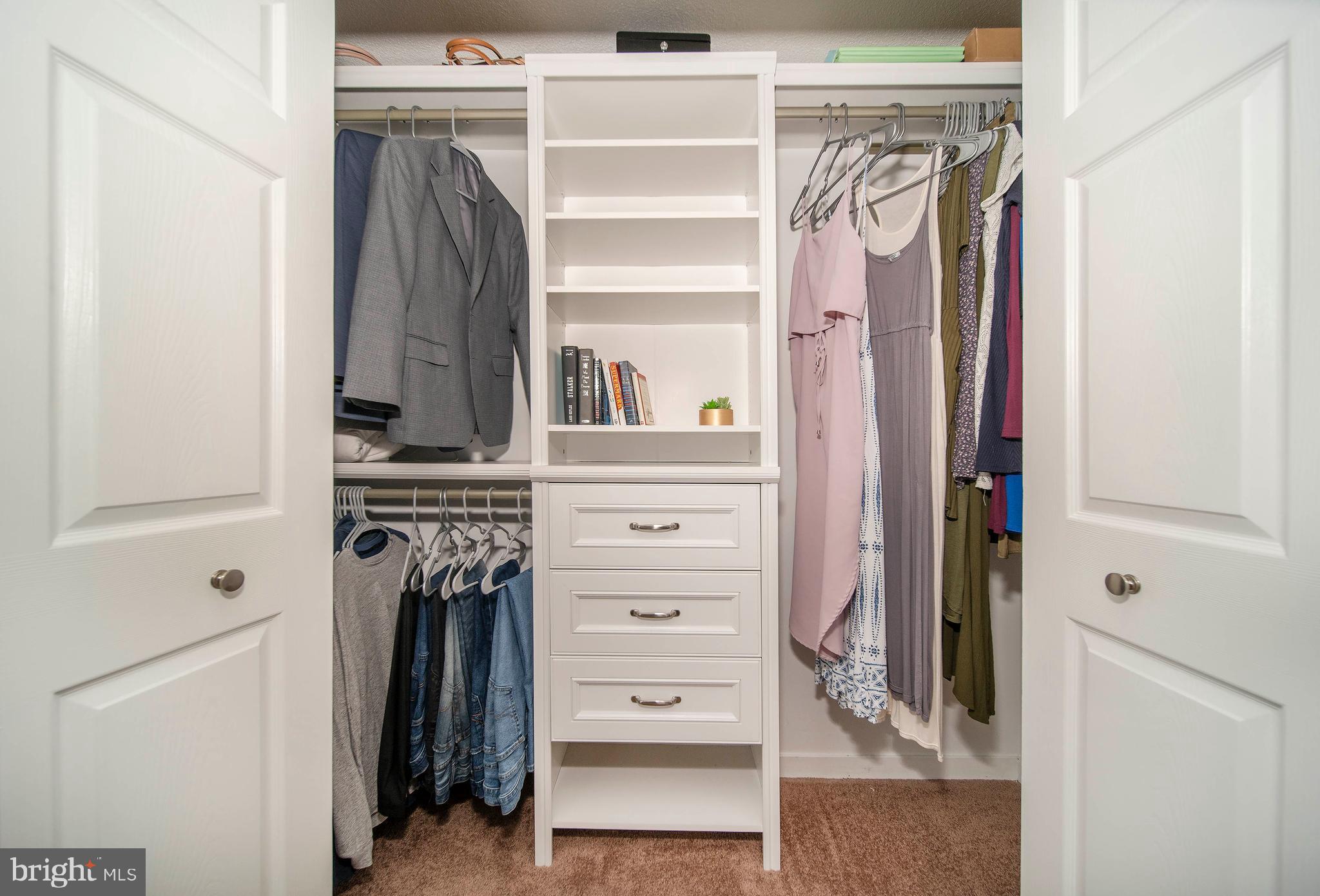 16 Leader Drive Newark, DE 19713 - Photo 13 of 28 a view of walk in closet with clothes and shoes