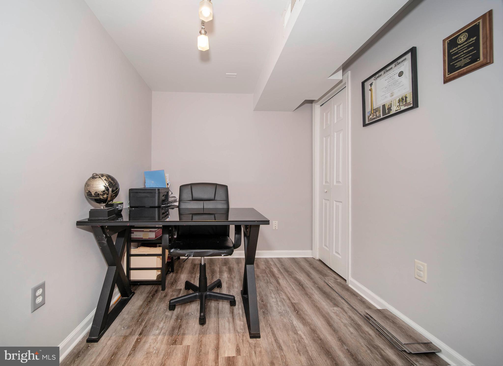 16 Leader Drive Newark, DE 19713 - Photo 22 of 28 a view of a workspace with furniture and wooden floor