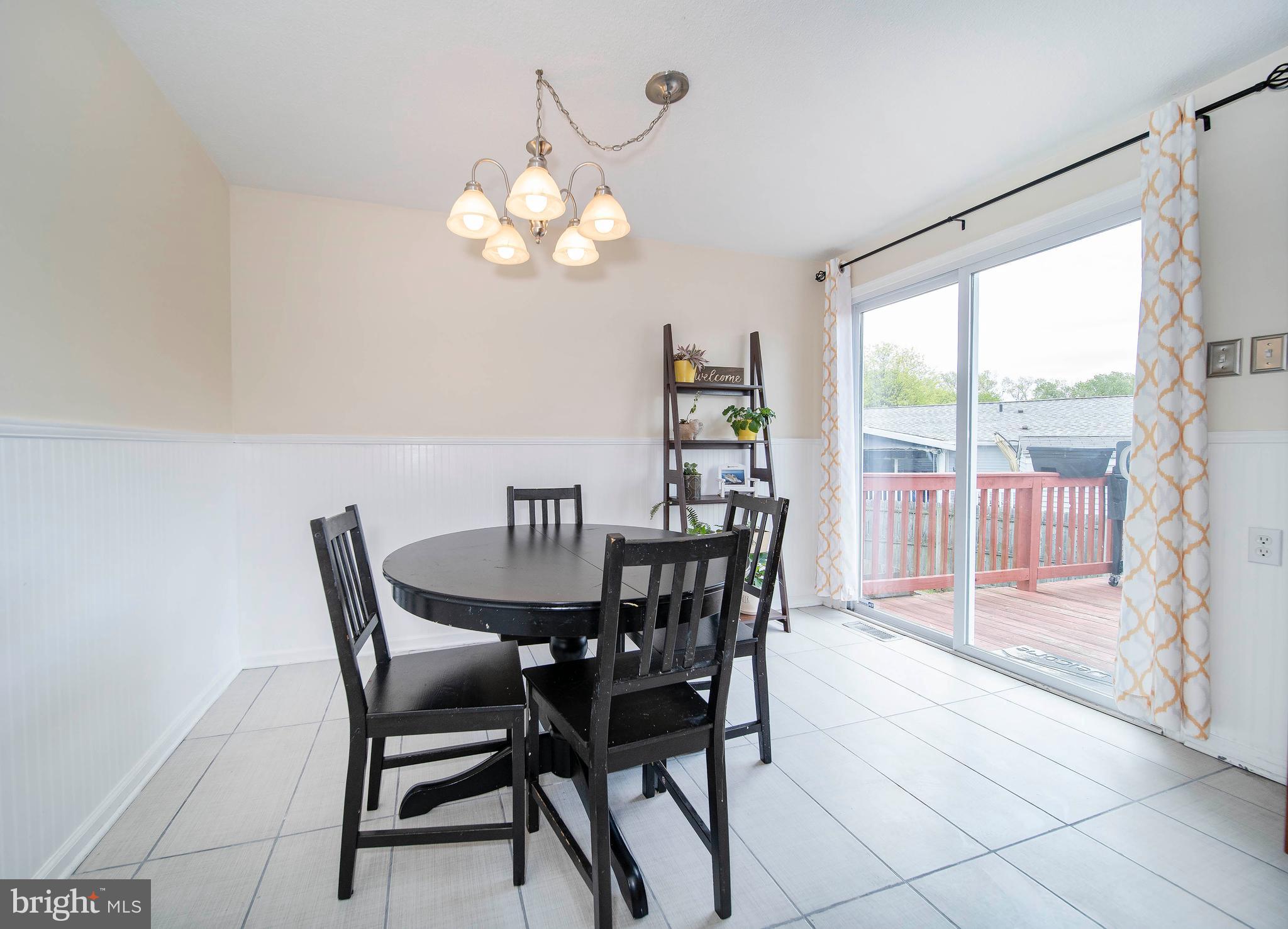 16 Leader Drive Newark, DE 19713 - Photo 10 of 28 a view of a dining room with furniture wooden floor and chandelier