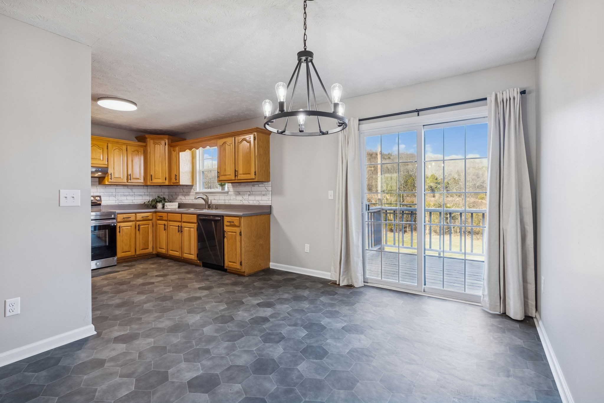 162 Pigeon Roost Road Brush Creek, TN 38547 - Photo 14 of 50 a kitchen with stainless steel appliances granite countertop a stove a sink dishwasher a refrigerator and a microwave