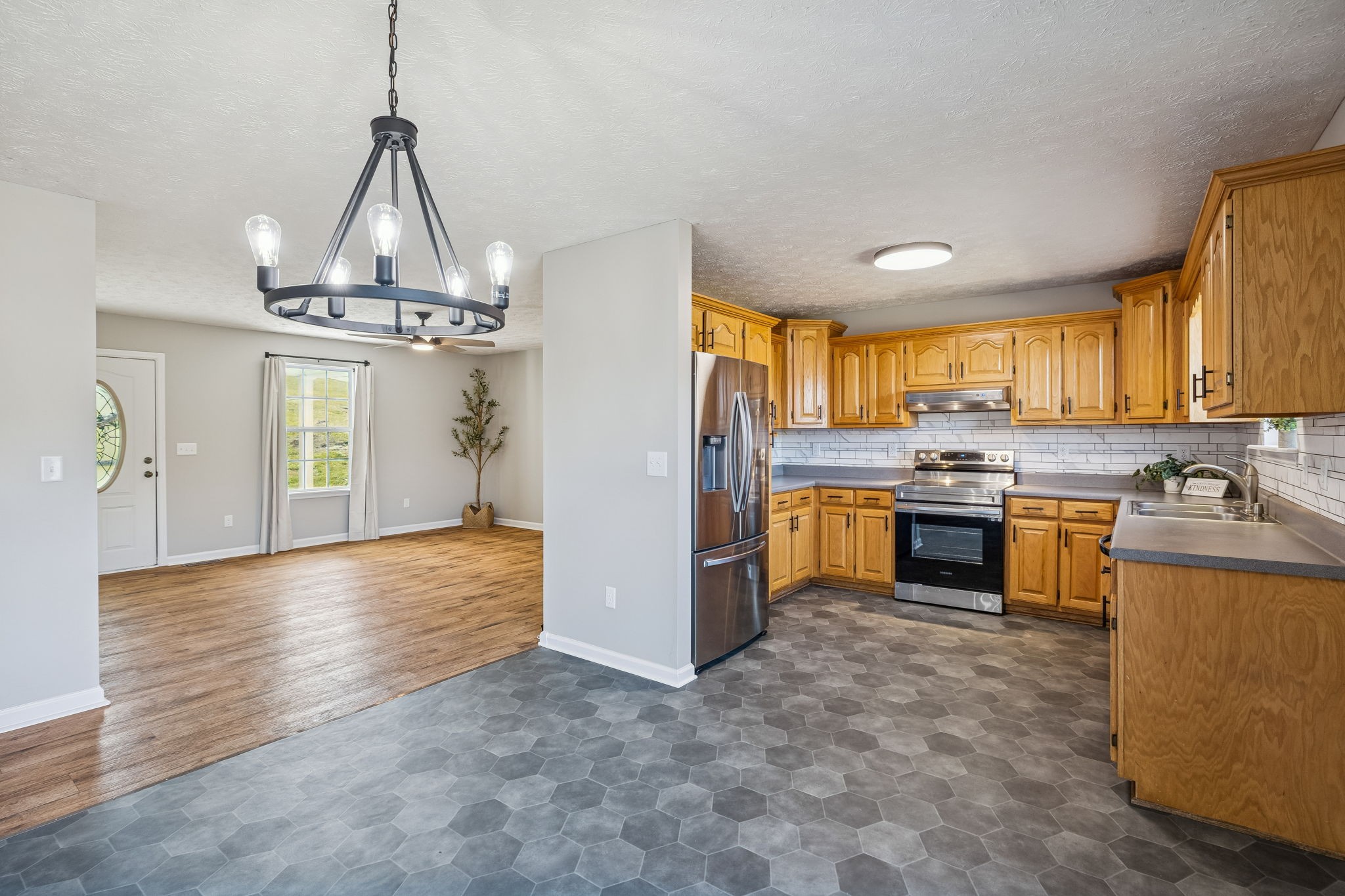 162 Pigeon Roost Road Brush Creek, TN 38547 - Photo 15 of 50 a open kitchen with stainless steel appliances granite countertop a stove a refrigerator and a sink
