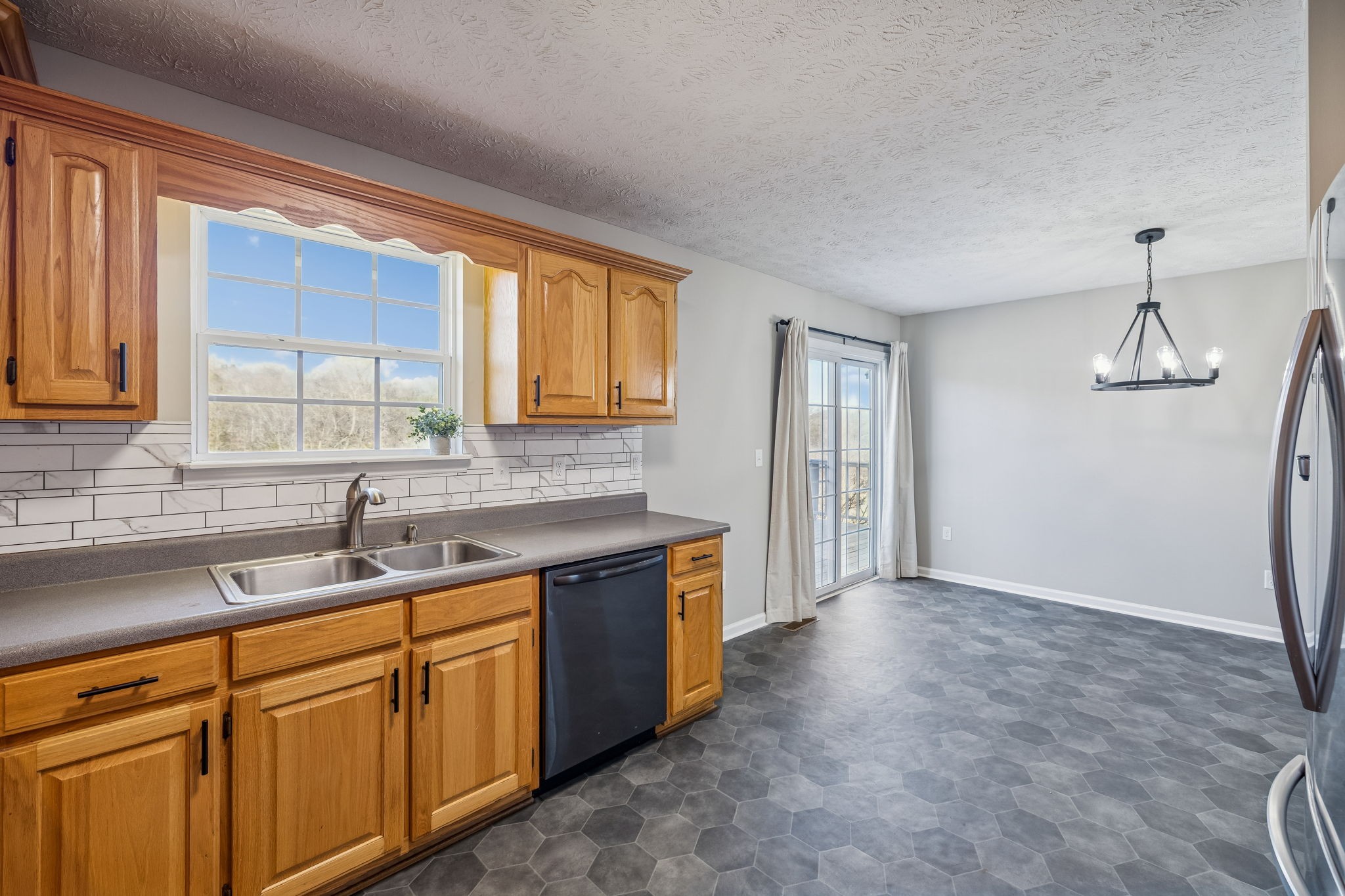 162 Pigeon Roost Road Brush Creek, TN 38547 - Photo 18 of 50 a kitchen that has a sink and a stove