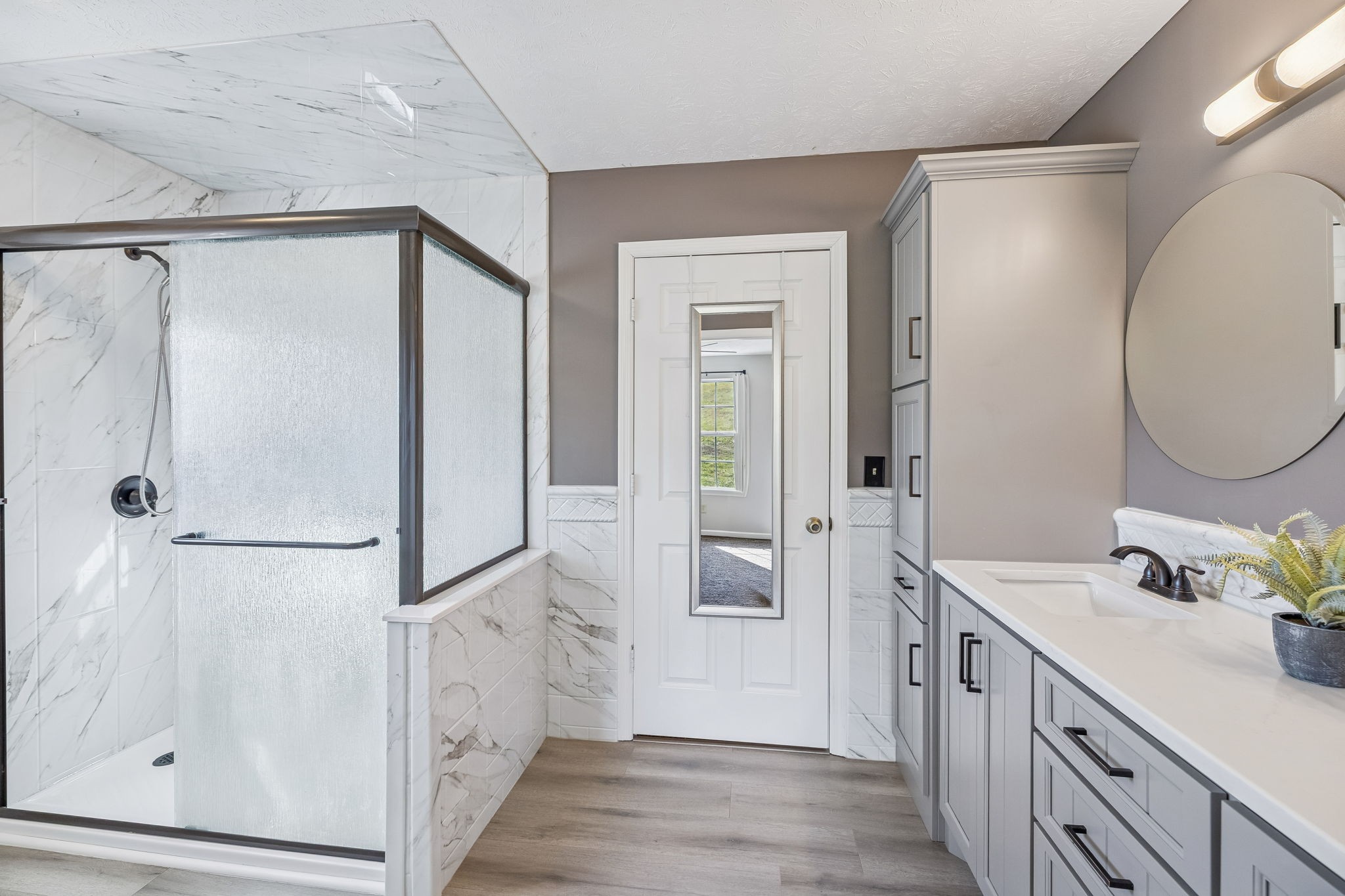 162 Pigeon Roost Road Brush Creek, TN 38547 - Photo 25 of 50 a bathroom with a double vanity sink mirror and shower