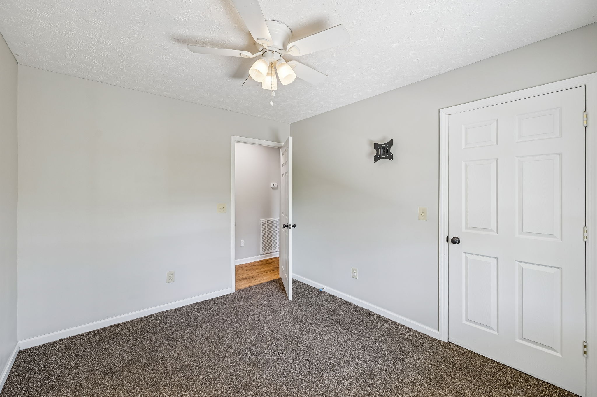 162 Pigeon Roost Road Brush Creek, TN 38547 - Photo 32 of 50 an empty room with a ceiling fan and a window